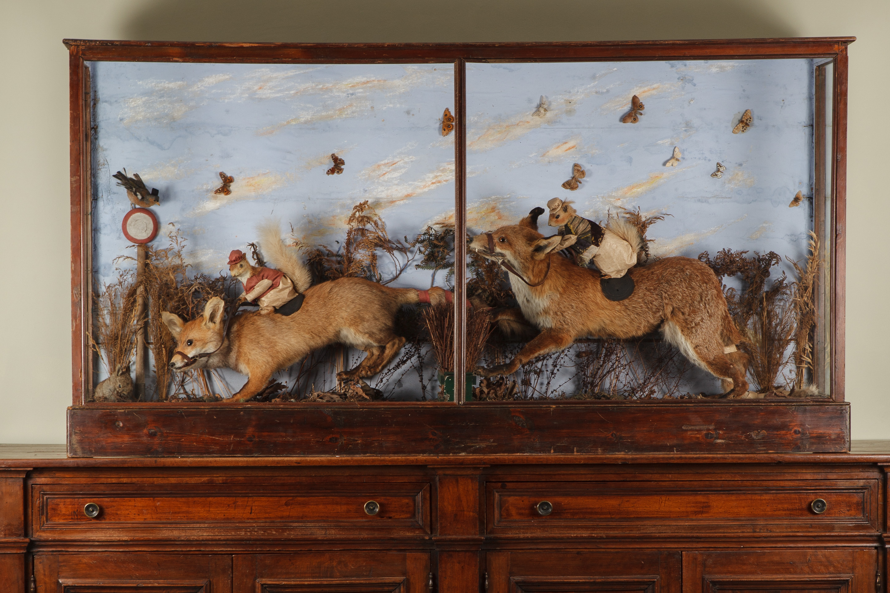 The Big Race- An Early Victorian Taxidermy Tableau Of Fox Racing Squirrels in the manner of Walter Potter. Unsigned.